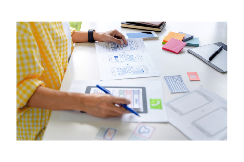 Whitney leaning against a railing on a downtown street