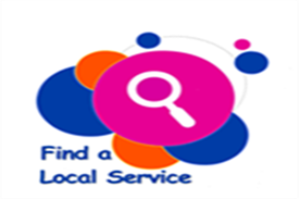 Whitney leaning against a railing on a downtown street