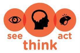 Whitney leaning against a railing on a downtown street