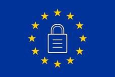 Whitney leaning against a railing on a downtown street