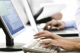 Whitney leaning against a railing on a downtown street